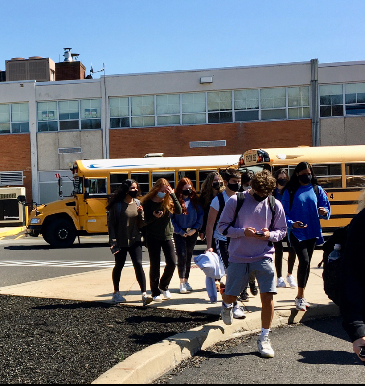 Juniors and seniors walk to their cars at the end of the school day.