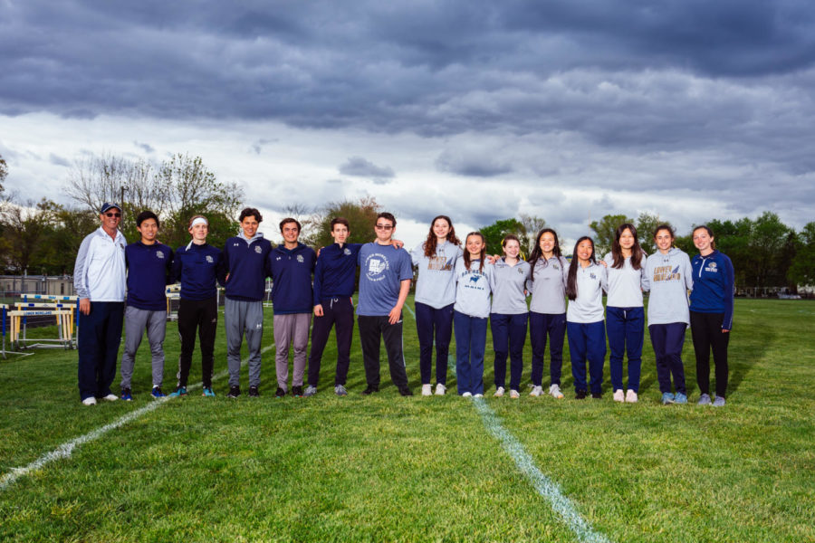 Graduating members of the track team line up next to Coach Green  |  All photo credit: Taka Ogawa