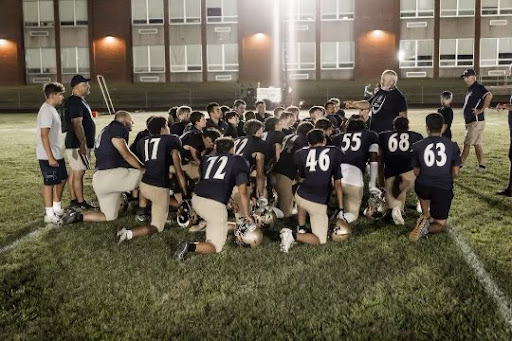 Coach Dom and the Lower Moreland High School football team